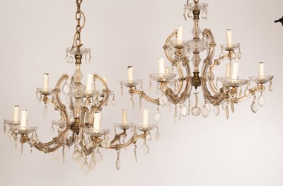 Lot 821 - A pair of glass nine-light chandeliers with...