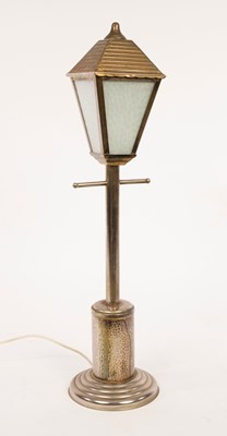 Lot 827 - An Arts & Crafts style table lamp, in the form...