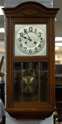 Lot 865 - An Edwardian wall clock with silvered dial,...