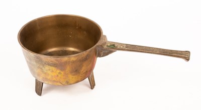 Lot 909 - A brass skillet, the handle indistinctly...