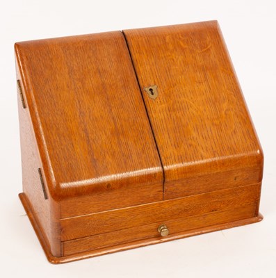 Lot 920 - An oak stationery box with slope front and a...