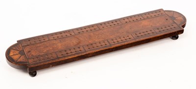 Lot 926 - A fruitwood cribbage board, the rounded ends...