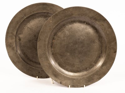 Lot 937 - A pair of pewter chargers with folded rims,...