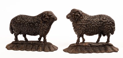 Lot 943 - A near pair of cast iron doorstops modelled as...