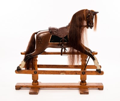 Lot 975 - An early 20th Century rocking horse by G & J...