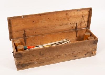 Lot 979 - A croquet set in a wooden case, 100cm wide