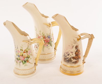Lot 20 - Two Royal Worcester tusk-shaped jugs, each...
