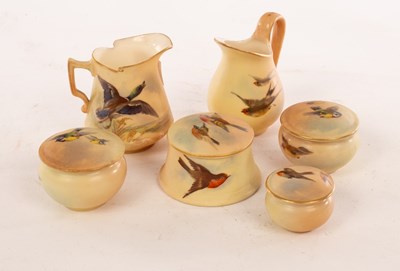 Lot 27 - Four Royal Worcester miniature lidded boxes of...
