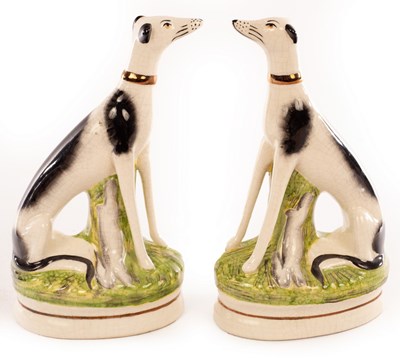 Lot 60 - A pair of Staffordshire greyhounds each with a...