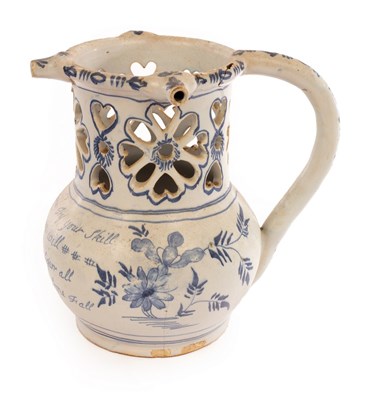 Lot 74 - An English Delftware puzzle jug inscribed with...