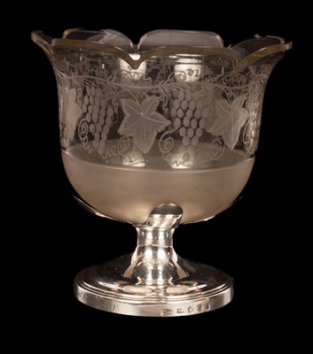 Lot 111 - An engraved glass vase with serrated border...