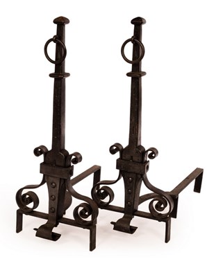 Lot 302 - A pair of wrought iron fire dogs with ring...