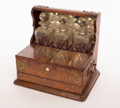 Lot 328 - A late 19th Century brass mounted oak tantalus...