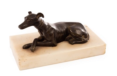 Lot 348 - A bronze figure of a recumbent whippet, the...