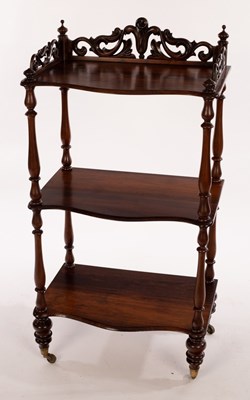 Lot 410 - A Victorian rosewood three-tier whatnot with...