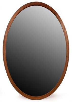 Lot 434 - An Edwardian mahogany oval wall mirror with...