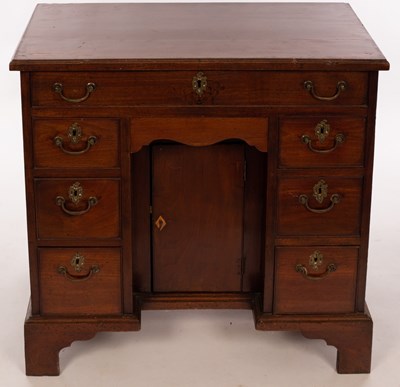 Lot 468 - A Georgian mahogany kneehole desk, with eight...