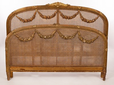 Lot 481 - A French late 19th Century caned bed head and...