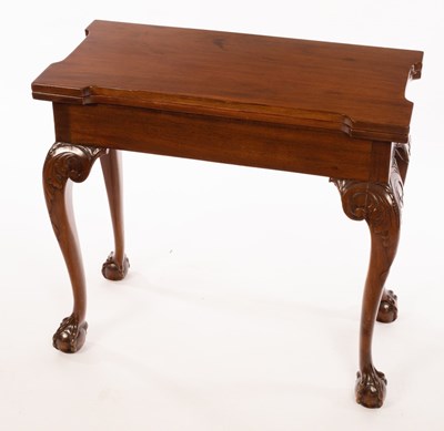 Lot 507 - A Georgian mahogany tea table with shaped top...