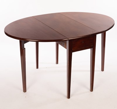 Lot 509 - A George III mahogany oval two-flap table on...