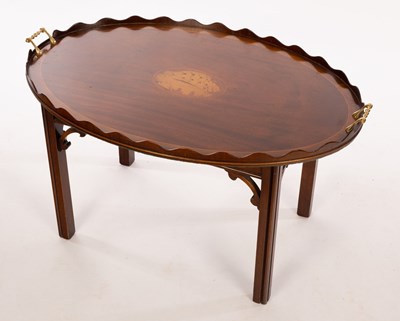 Lot 517 - A tray top coffee table, the oval top with a...