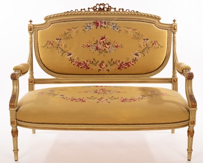 Lot 518 - An upholstered salon suite, the parcel gilt...