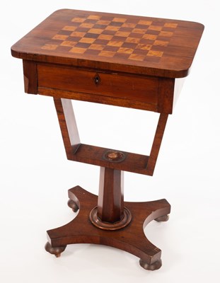 Lot 521 - A Regency rosewood work table, the top inlaid...