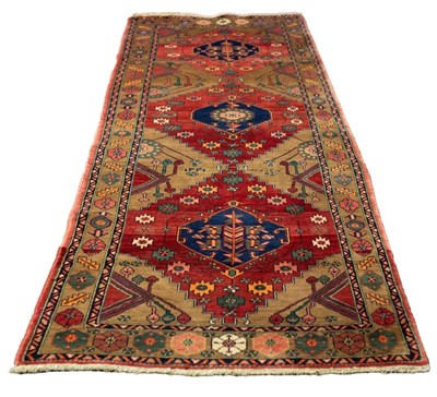 Lot 551 - A North East Persian Heriz runner, 340cm x 112cm