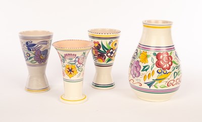 Lot 223 - Poole Pottery, four floral vases, the largest...