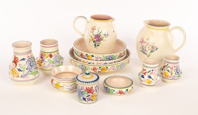 Lot 227 - Poole Pottery, two floral jugs, one with...