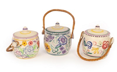 Lot 231 - Poole Pottery, three floral biscuit barrels...