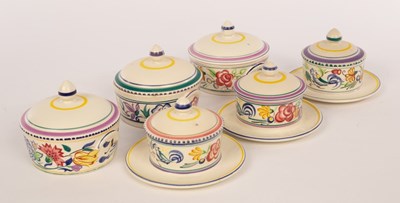 Lot 250 - Poole Pottery, three floral butter dishes with...