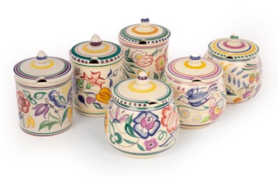 Lot 251 - Poole Pottery, three floral jam pots and...