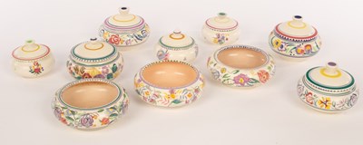 Lot 252 - Poole Pottery, four floral lidded bowls, 12cm...