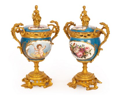 Lot 287 - A pair of Sèvres style cups and covers, the...