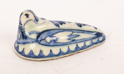 Lot 317 - A 19th Century Persian recumbent duck, blue...