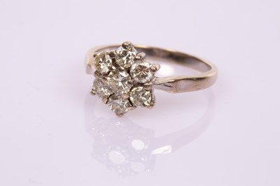 Lot 405 - A diamond seven-stone cluster ring set in 18ct...