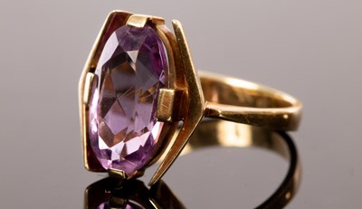 Lot 413 - An amethyst cocktail ring, the oval stone set...