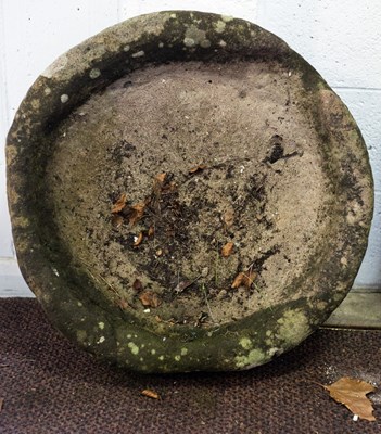 Lot 511 - A circular stone trough, 67cm diameter