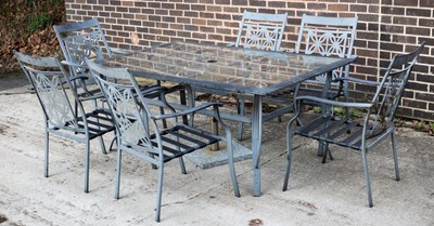 Lot 513 - A glass topped garden table, 170cm x 105cm...