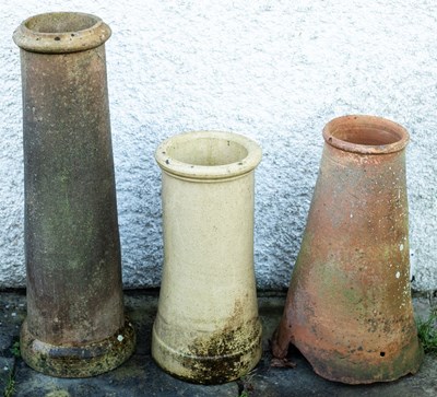 Lot 517 - Three various chimney pots, the tallest 93cm high