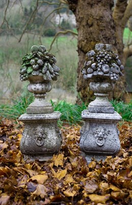 Lot 524 - A pair of reconstituted stone garden ornaments...