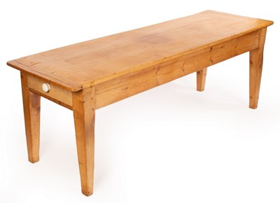 Lot 539 - A rectangular pine table with a drawer to each...