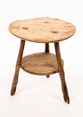 Lot 542 - A rustic elm circular cricket table with...