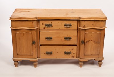 Lot 544 - A pine dresser base fitted cupboards and...