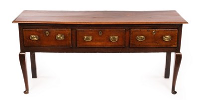 Lot 546 - A George III oak dresser fitted three drawers...