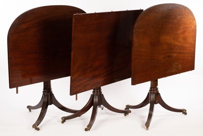 Lot 548 - A mahogany two-pillar dining table, fitted an...