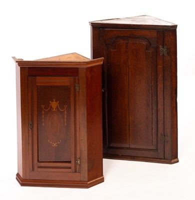 Lot 550 - An Edwardian corner cupboard with an inlaid...