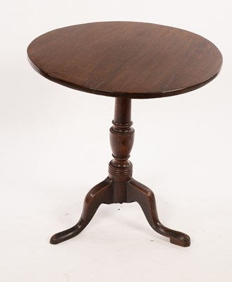 Lot 559 - A 19th Century oak table on a turned column...