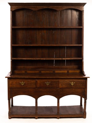 Lot 561 - A late 19th Century oak dresser, fitted three...